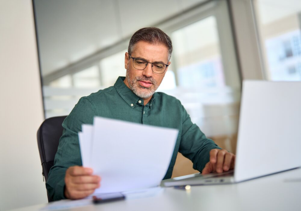 seller financing for landlords – landlord reviewing documents in a softening rent market