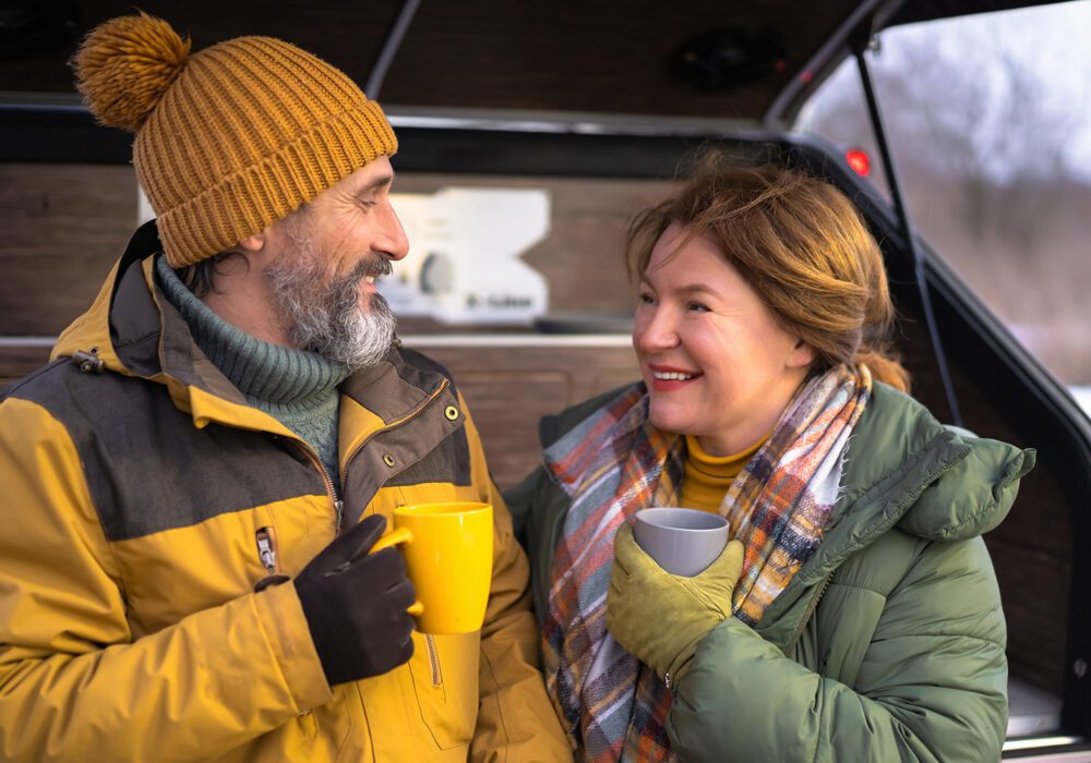 couple in camper van deciding what to do with money after selling a mortgage note