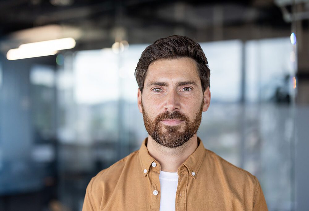 confident professional in a modern office representing who buys promissory notes